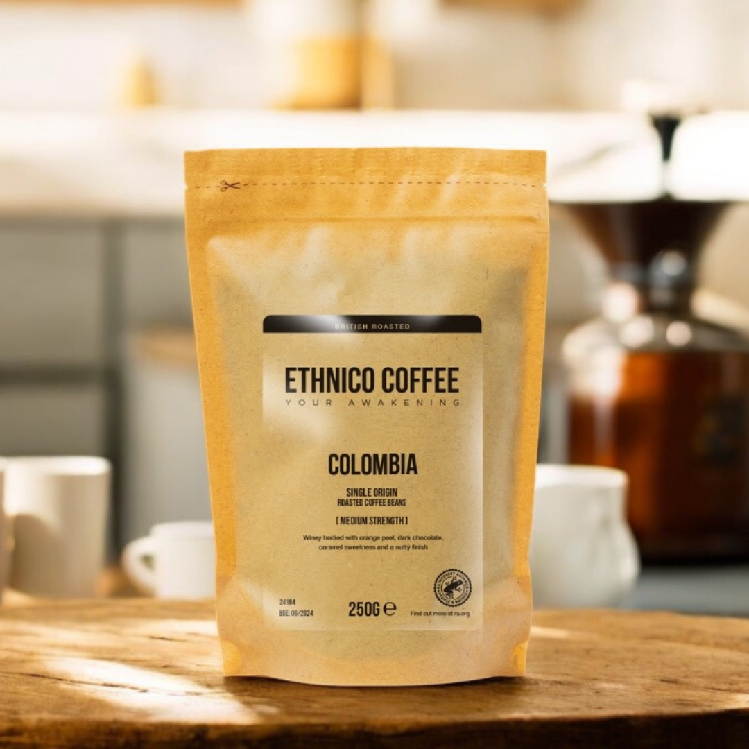 250g bag of Ethnico Colombian coffee beans with brewing equipment, highlighting fresh roasted specialty coffee for French press, espresso, or pour-over brewing.