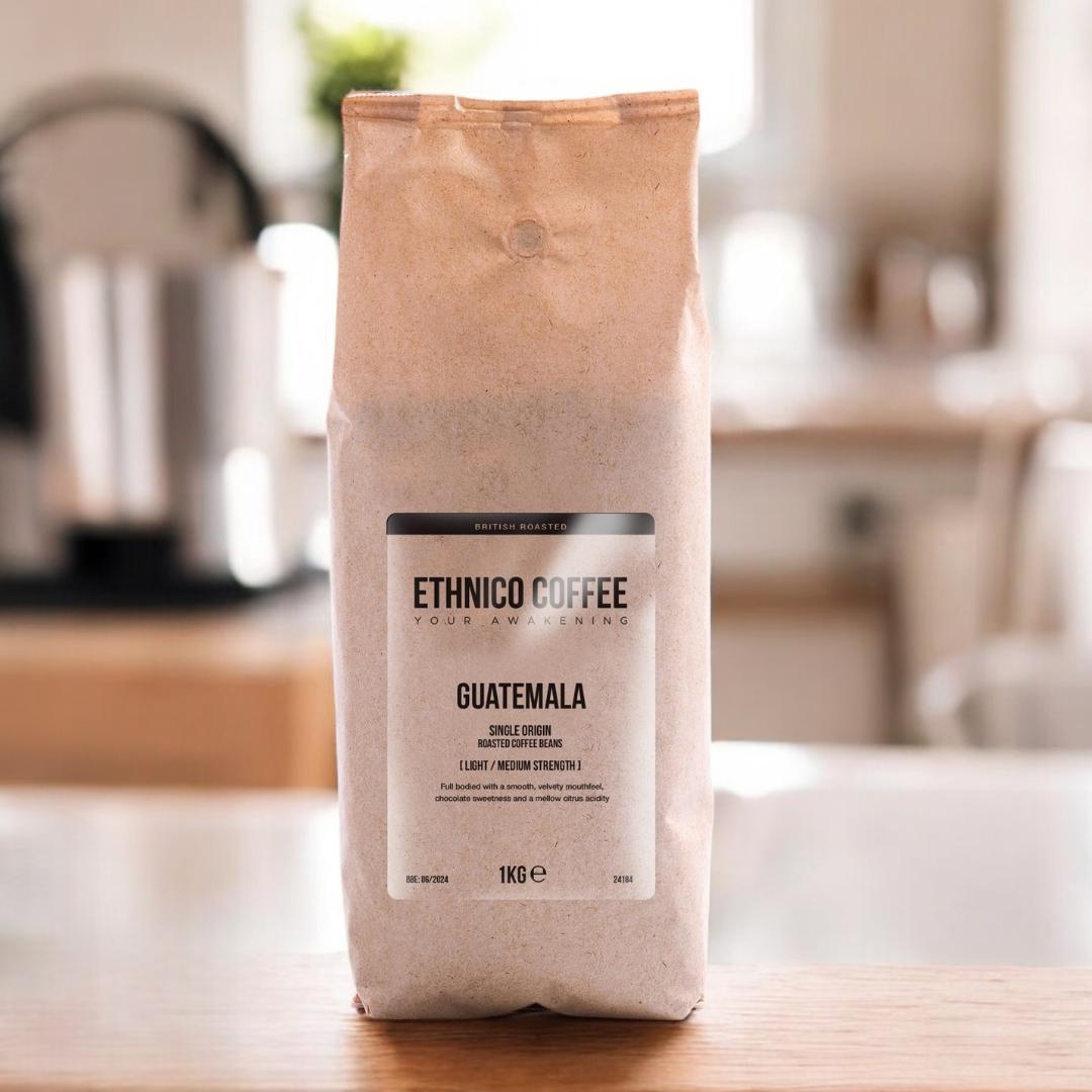 Ethnico 1kg Guatemalan coffee beans displayed with a French press, featuring freshly roasted specialty coffee for a full-bodied brew.